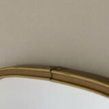 Vintage brass mirror in rear-view mirror shape