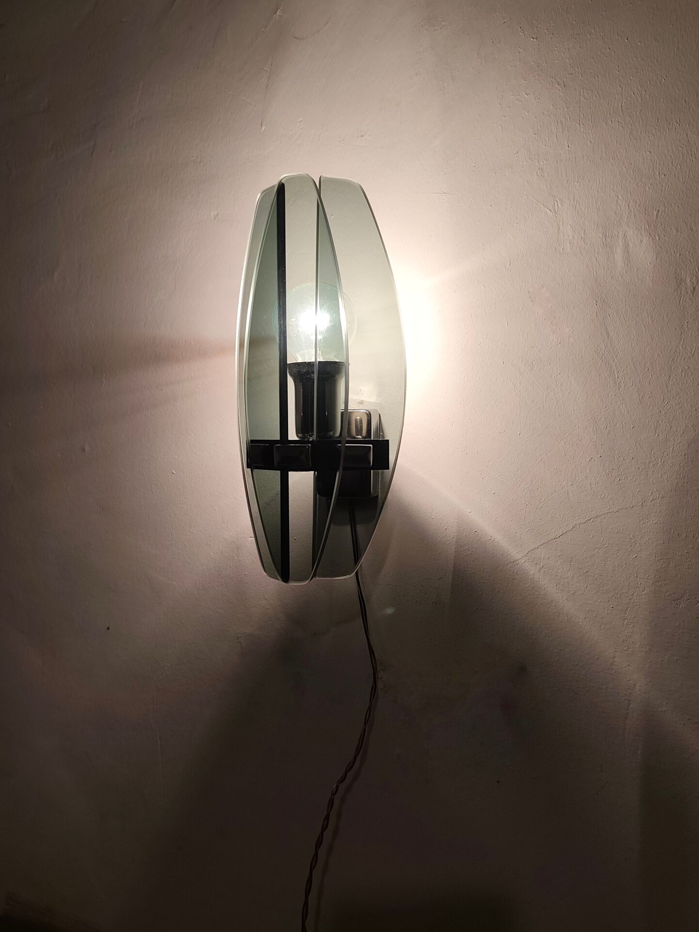 Smoked glass wall sconce. Italy, 1970s.