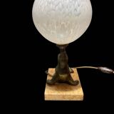 Lamp representing a seal on a marble base