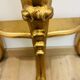 Golden console in Louis XV Rococo style made of resin.