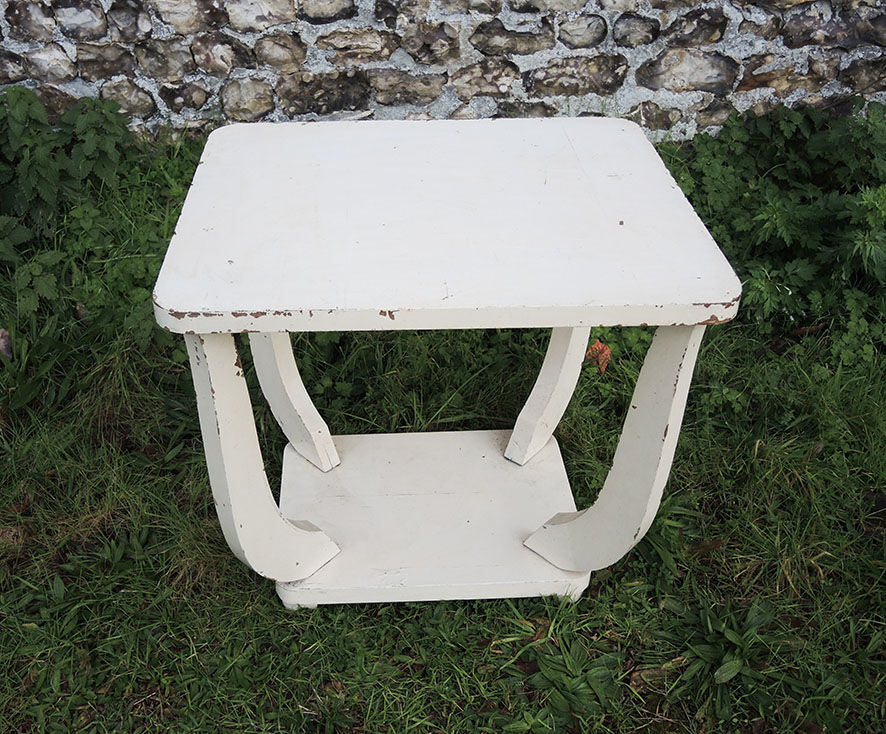 Old white wooden peestal table in art deco style