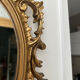 Petit miroir ovale signé Tallandier en laiton doré style Rococo – 30x2