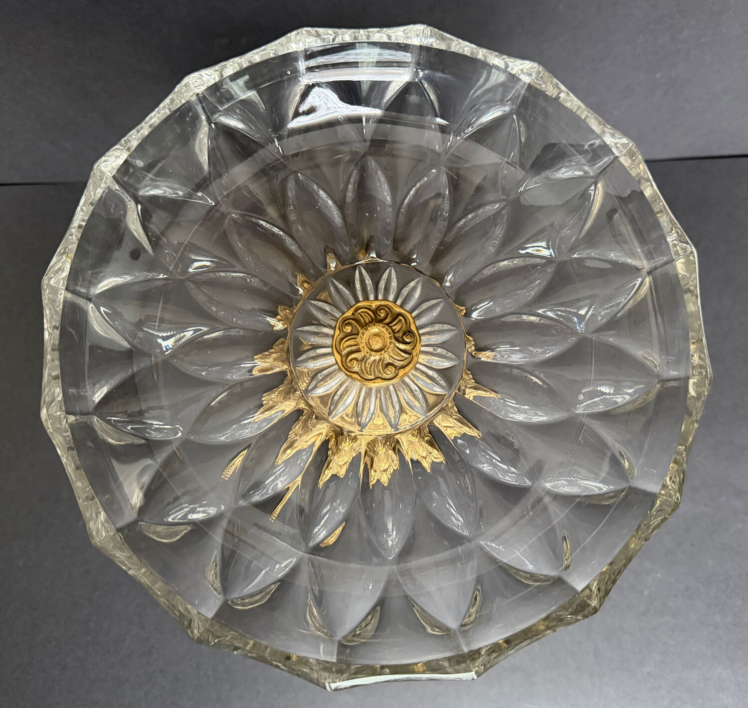 Antique crystal bowl on a bronze stand.