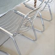 Lot of 2 chrome metal chairs by Gastone Rinaldi.