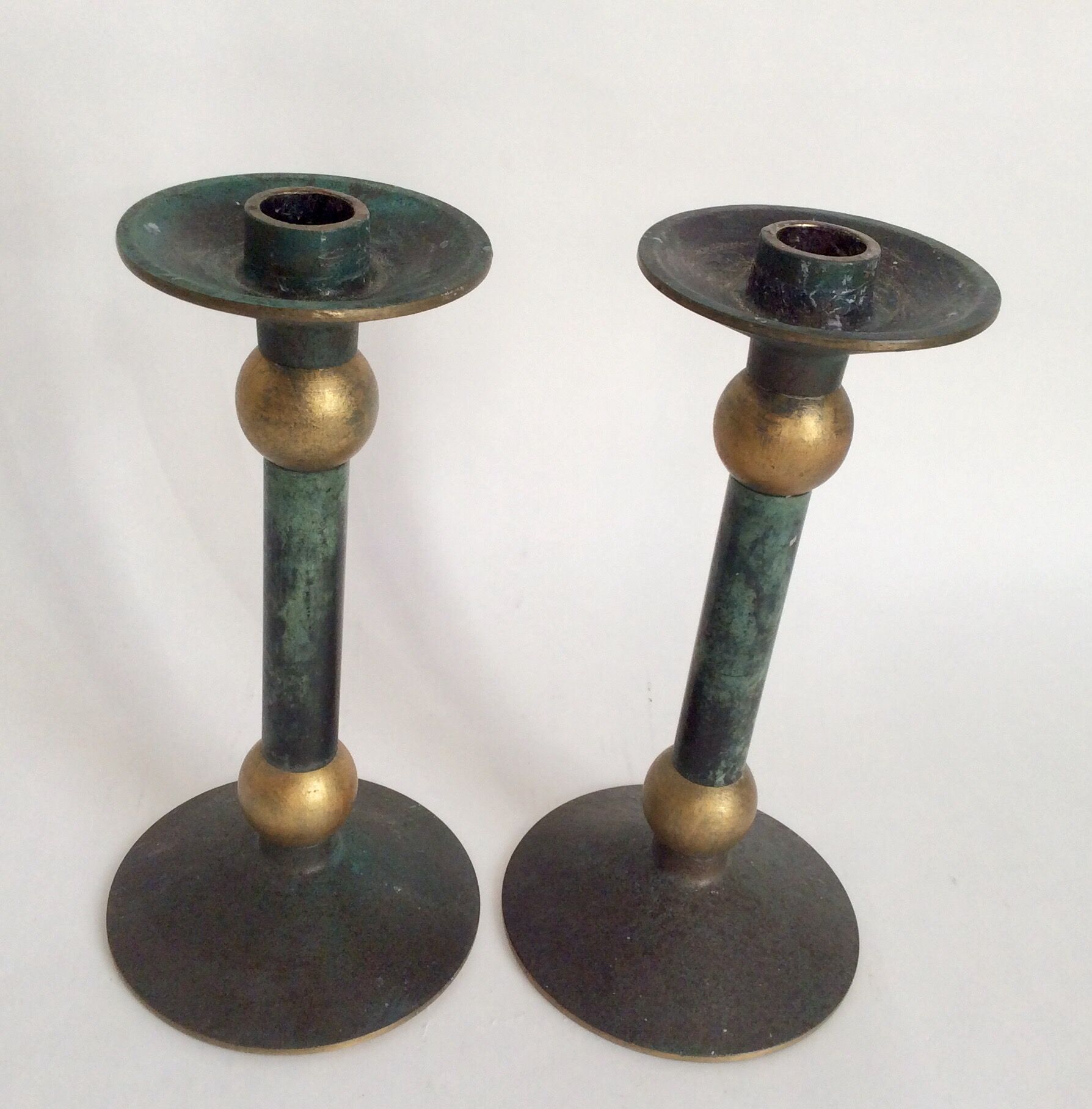 Pair of patinated bronze candlesticks