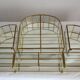 Pair of gilded brass, glass, mirror display cases from the 60s
