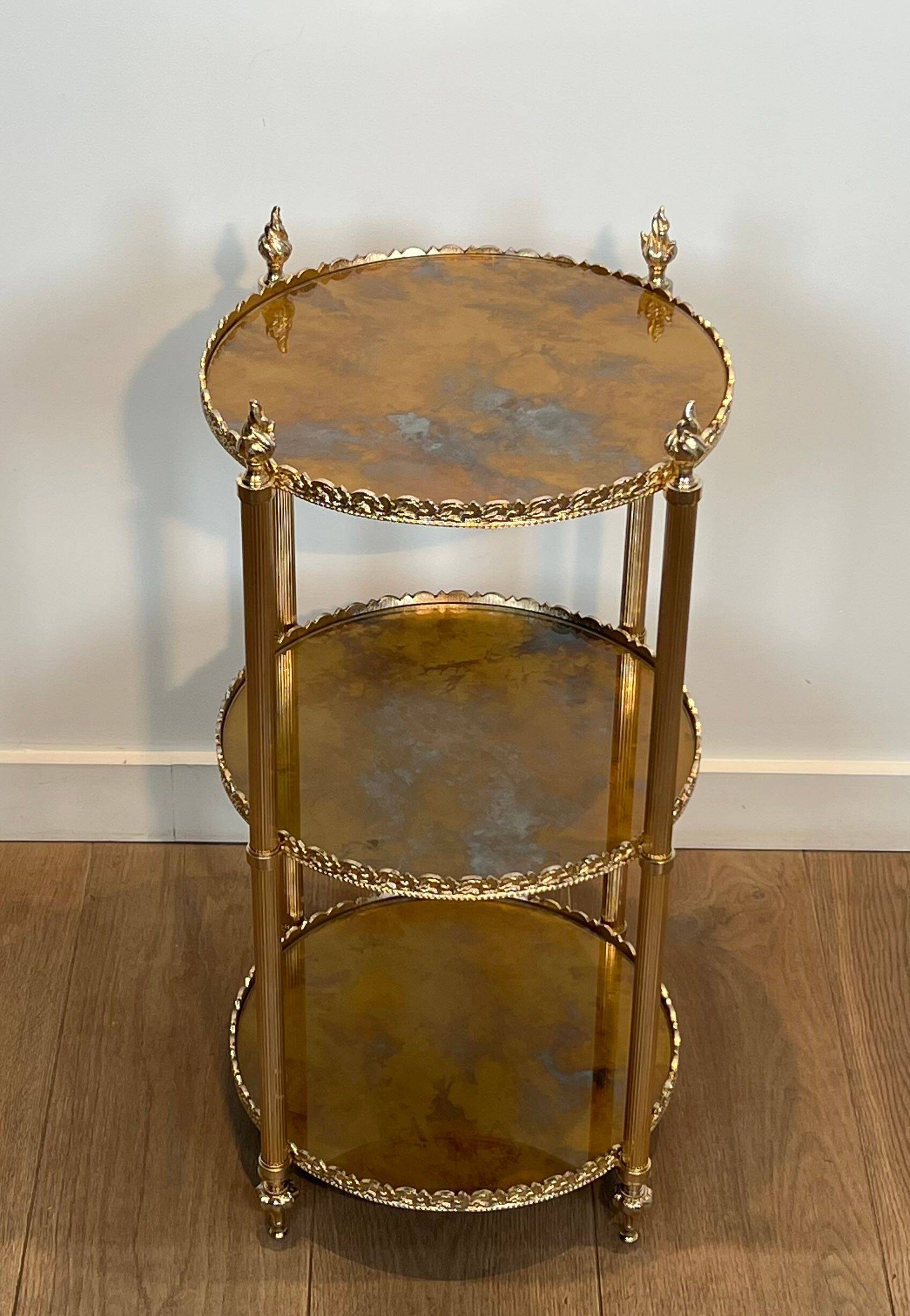 Round silver-plated brass table with triple eglomisé mirror tops from Maison Jansen.
