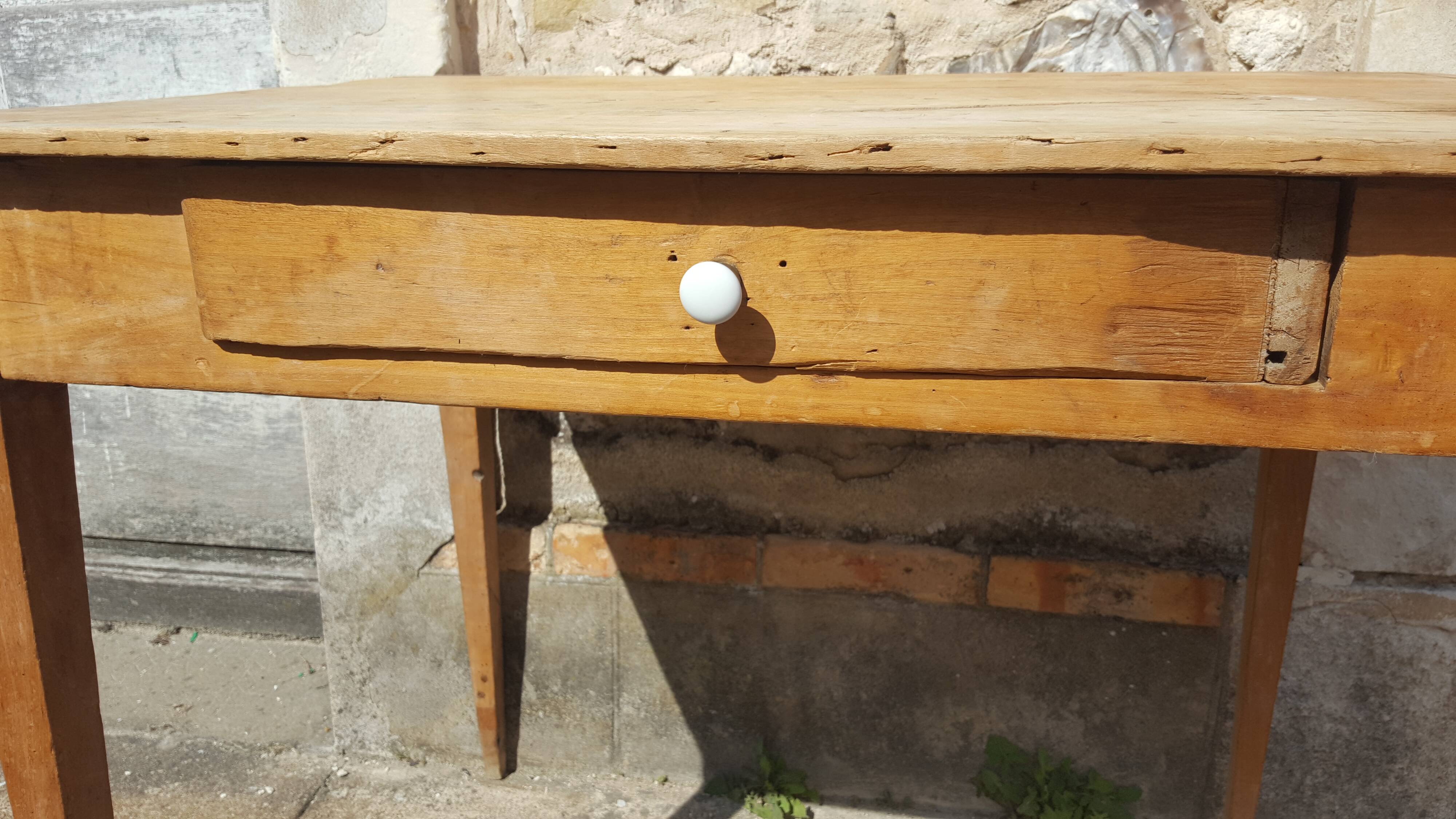 Raw wood farm table with drawer