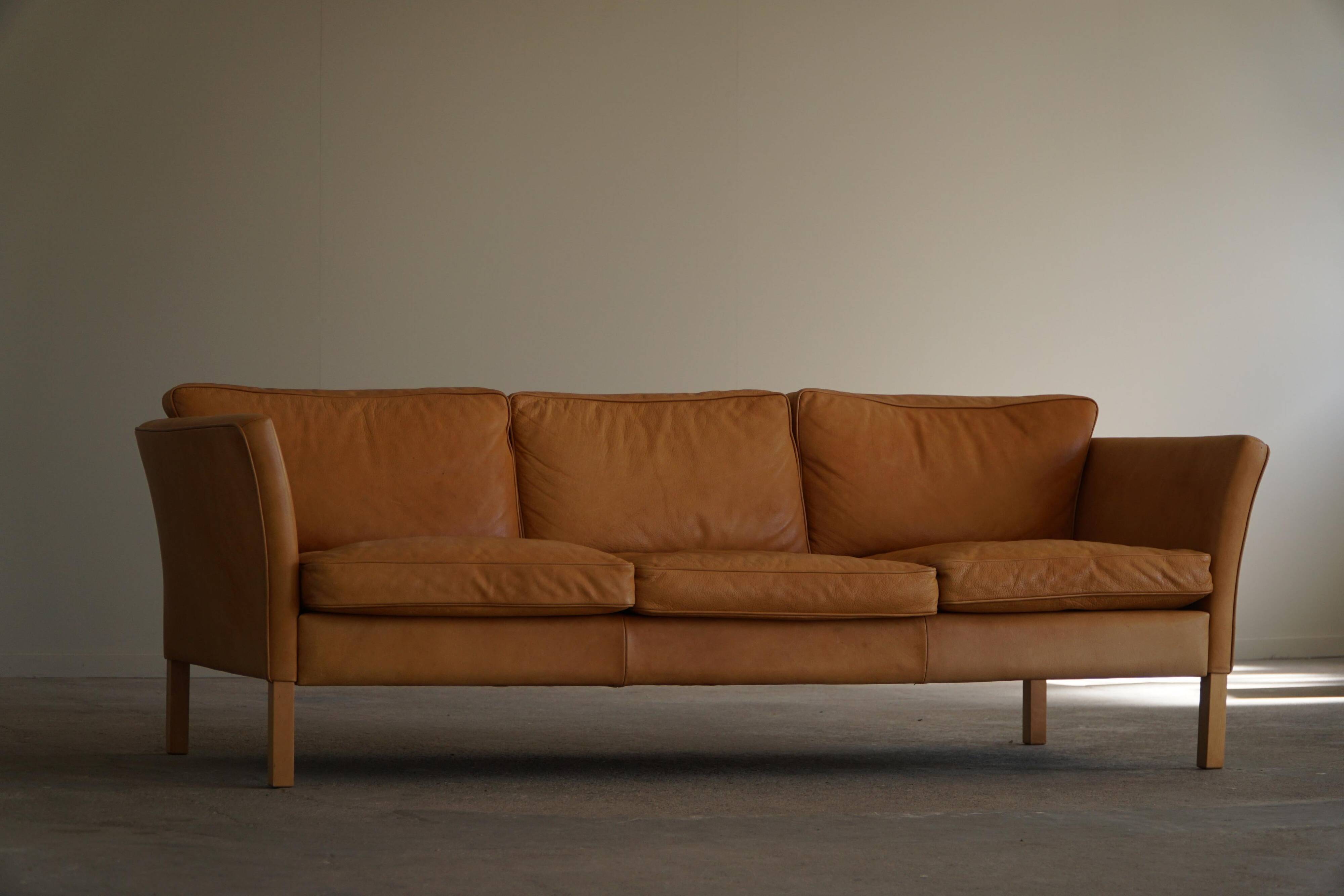 Danish Midcentury 3-seater canapé by Stouby in cognac brown leather, made in the 1970s.