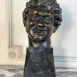 Head of a faun smiling, bronze after the antique, 19th century.