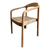 Solid wood chair with woven seat and armrests