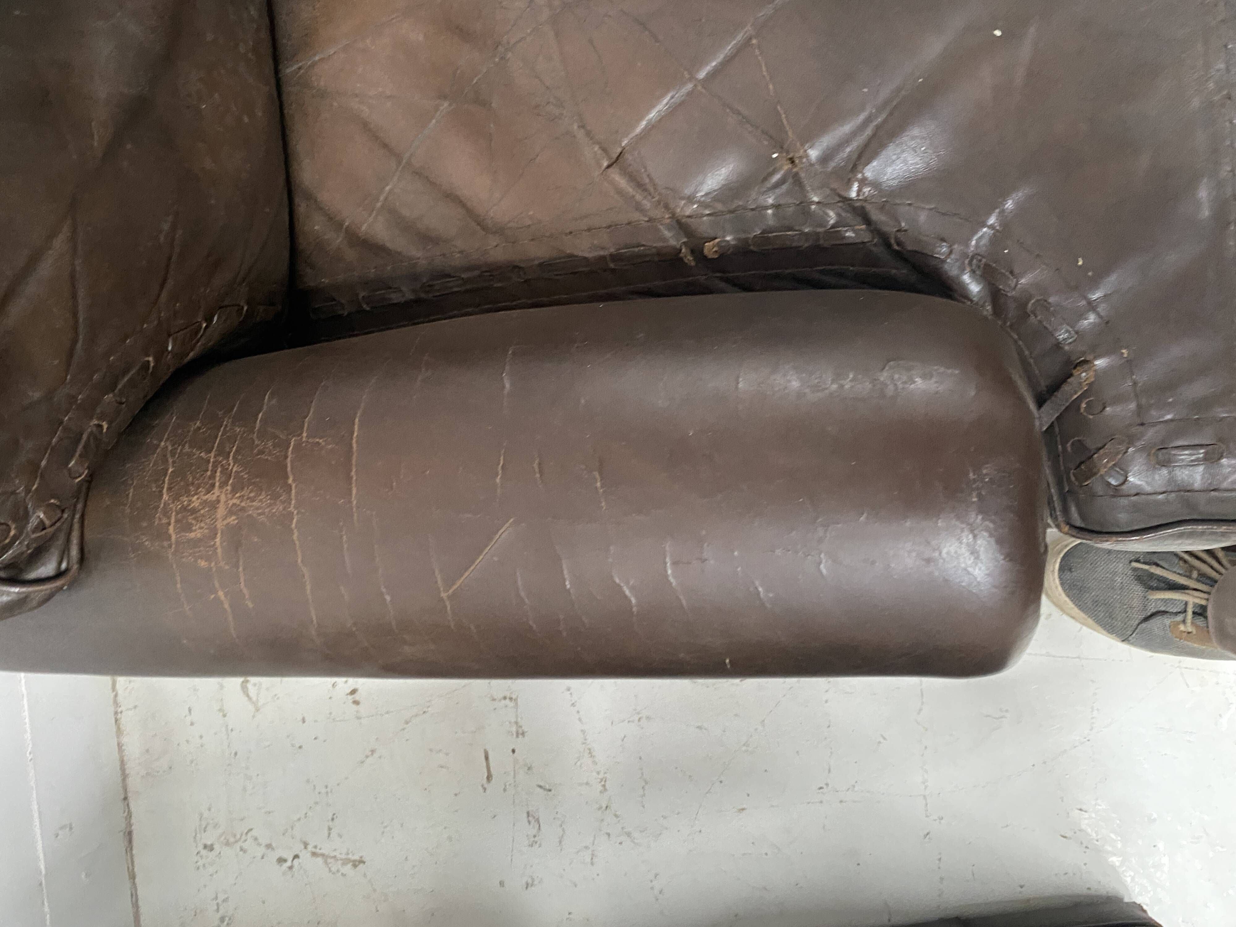 Pair of vintage brown leather armchairs from the 1970s.