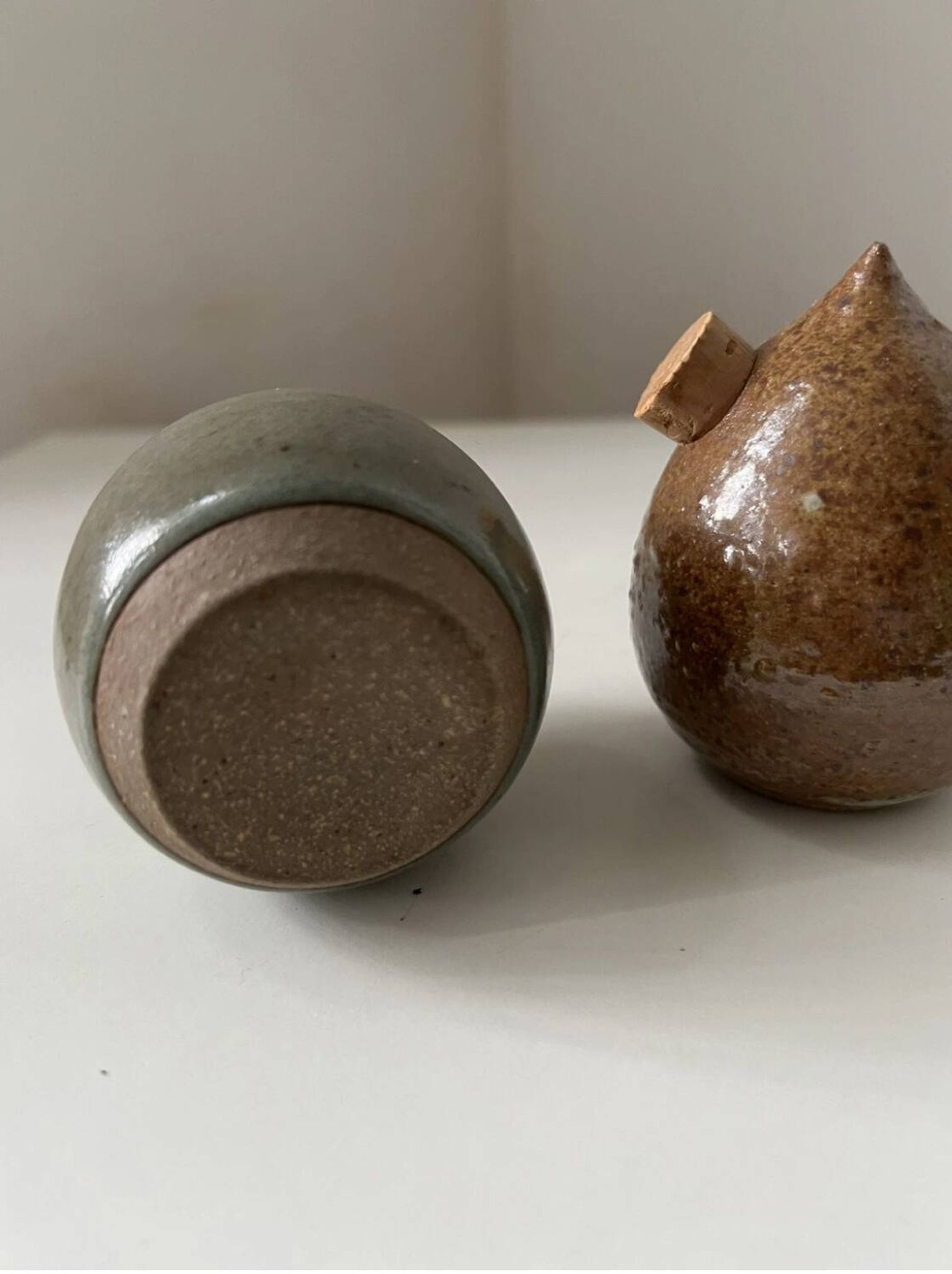 Pair of vintage round stoneware salt and pepper shakers