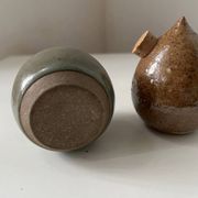 Pair of vintage round stoneware salt and pepper shakers