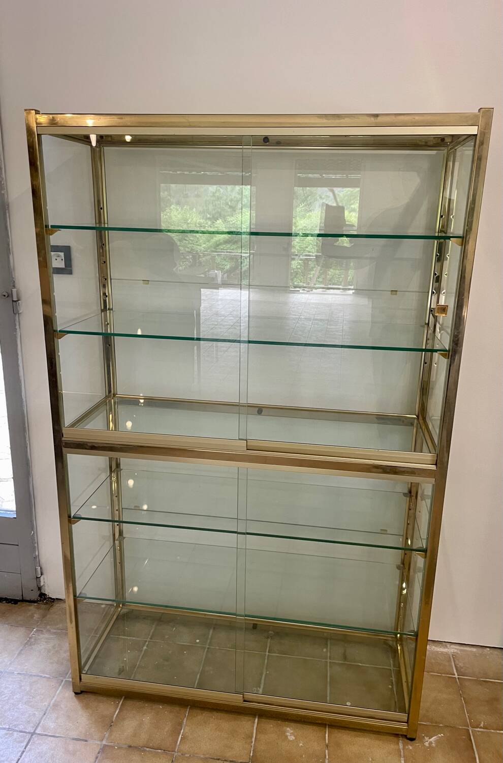Large exhibition window in gilded brass 20th century period