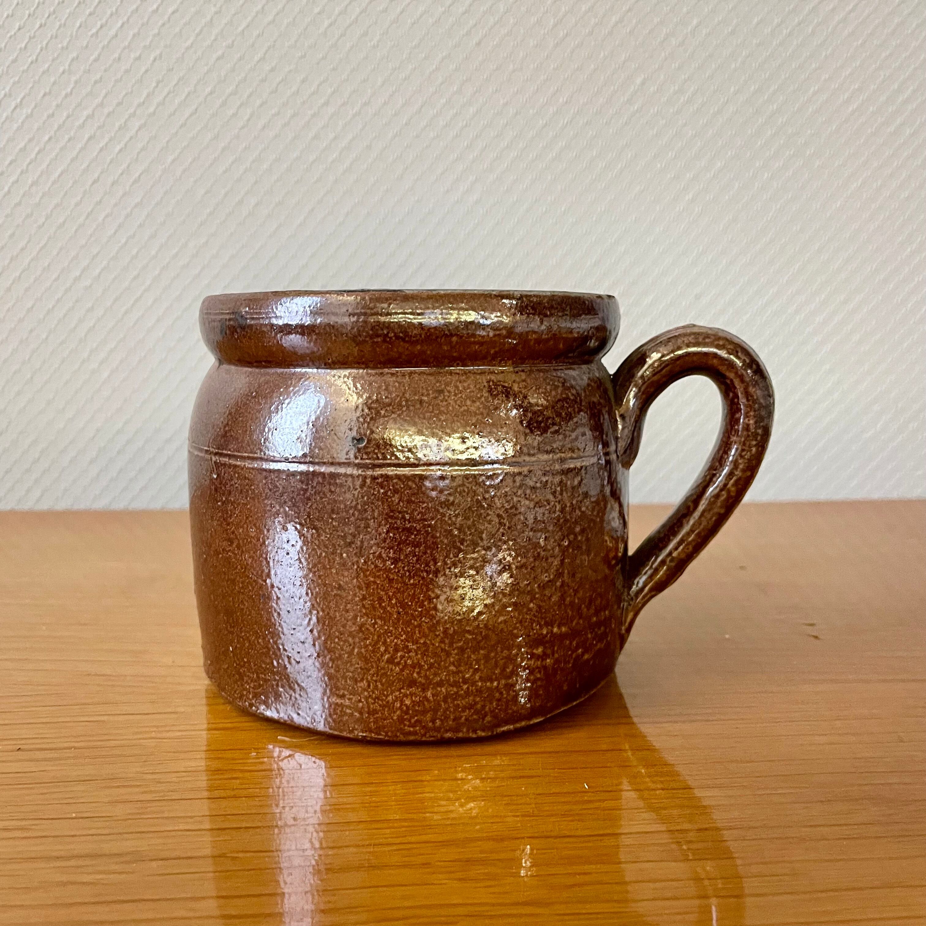 Stoneware pot with glossy glazed brown and vintage speckled gray handle