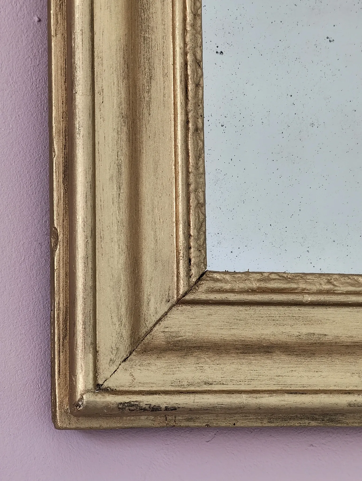 Small Art Deco mirror with a gilded wooden frame.