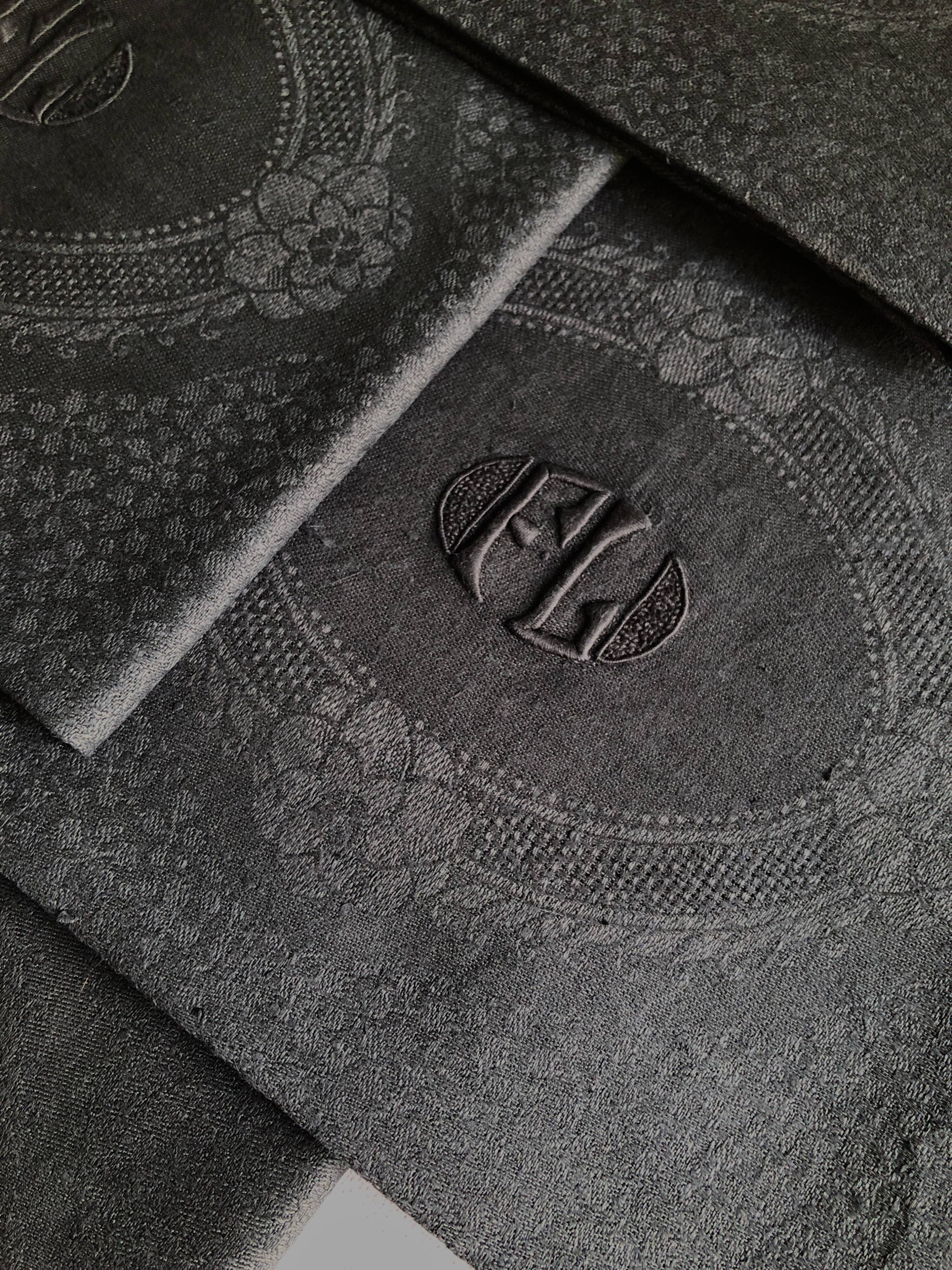 Set of four old damasked towels tinted black