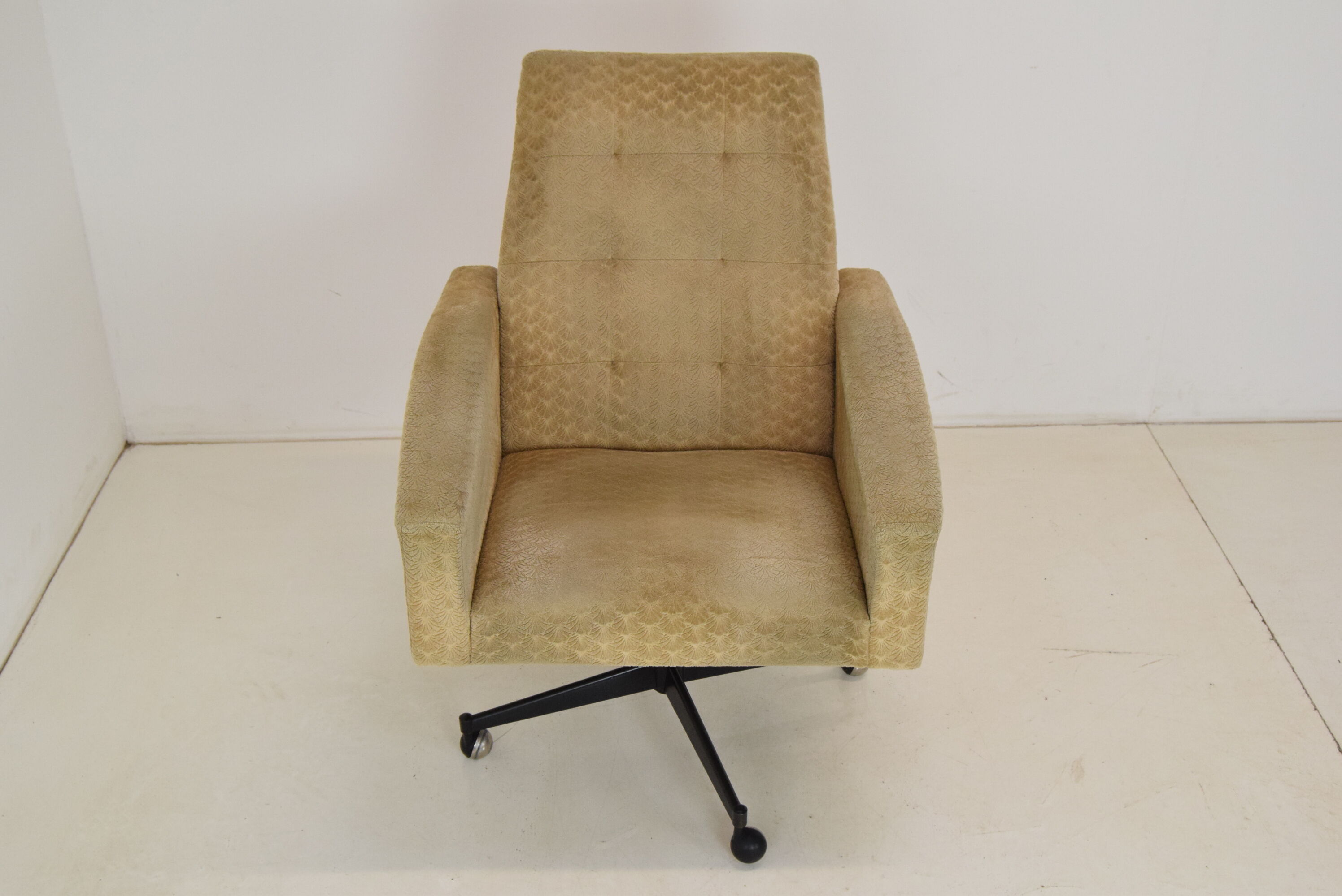 Mid-century swivel armchair with wheels 1970's