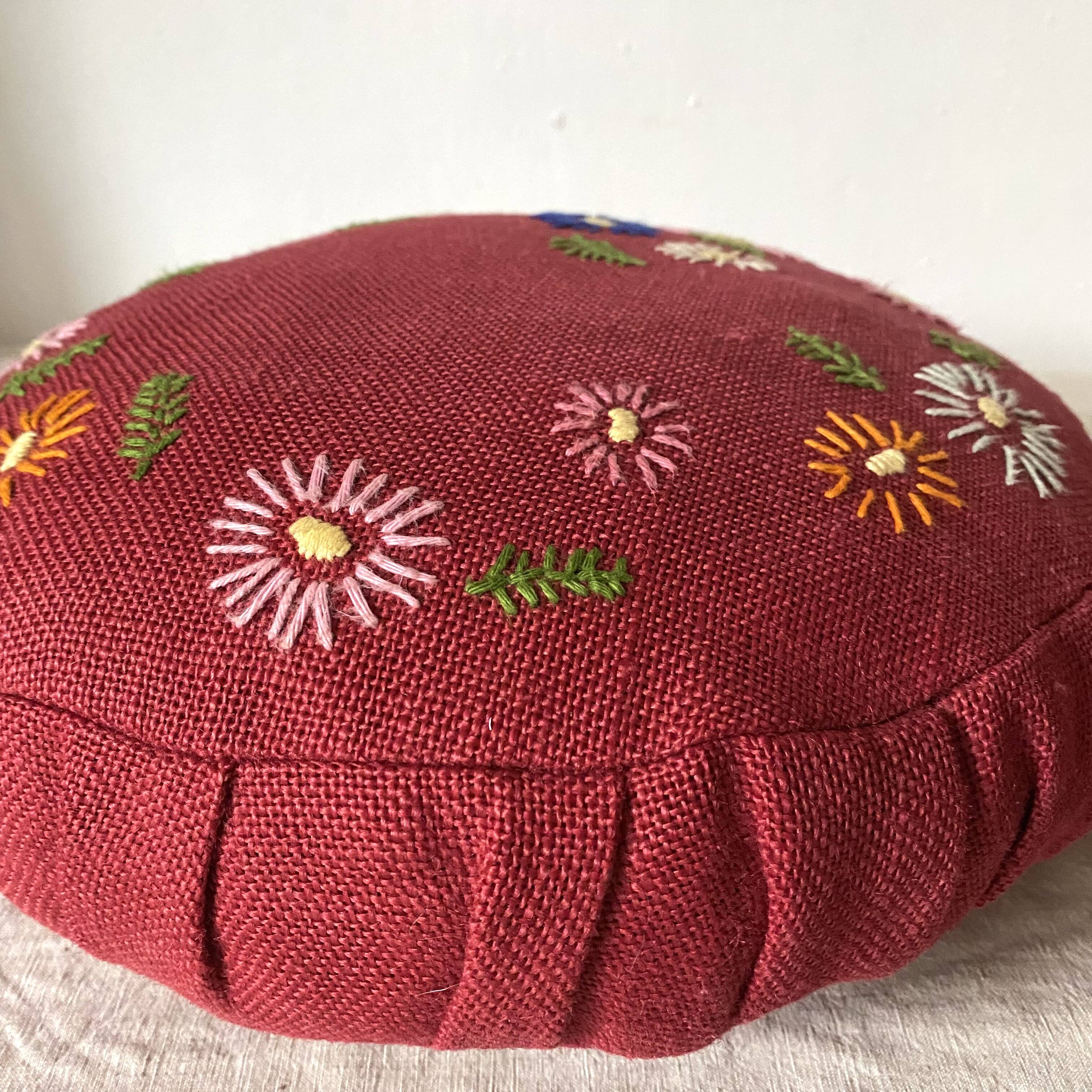 Paire de coussins ronds vintage en lin brodé