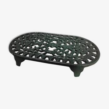 Vintage oval dark green cast iron trivet