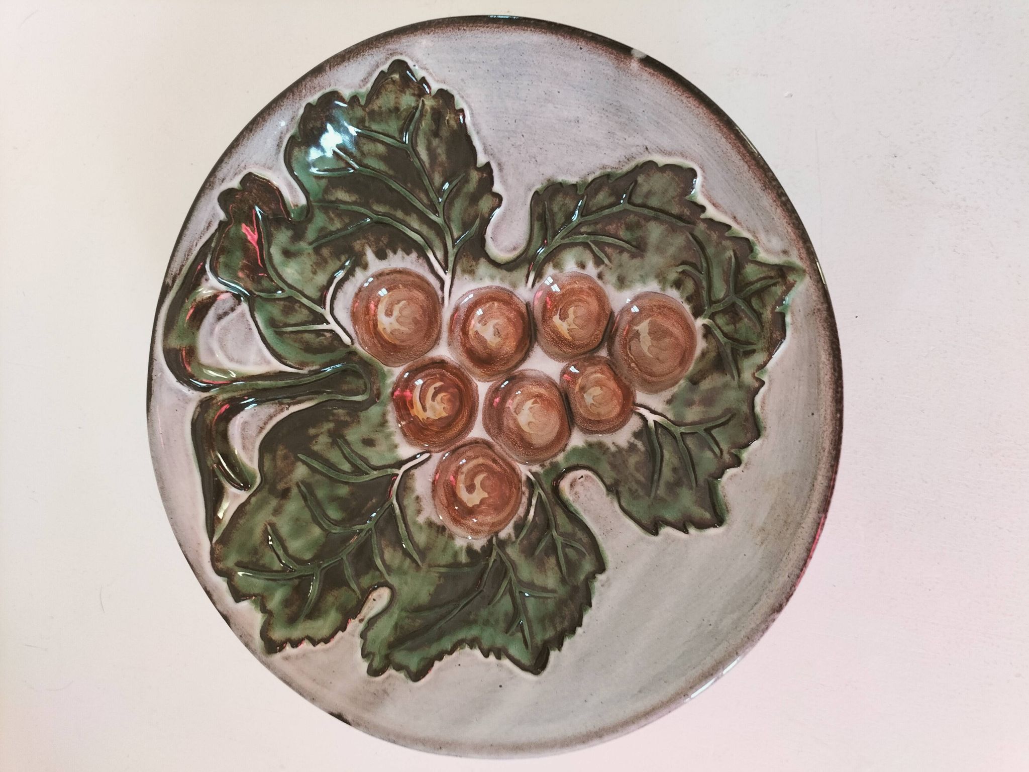 Vintage ceramic bowl – embossed grape pattern in slip style