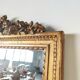 Miroir de cheminée en bois doré à décor de nœud et de roses H : 164 cm