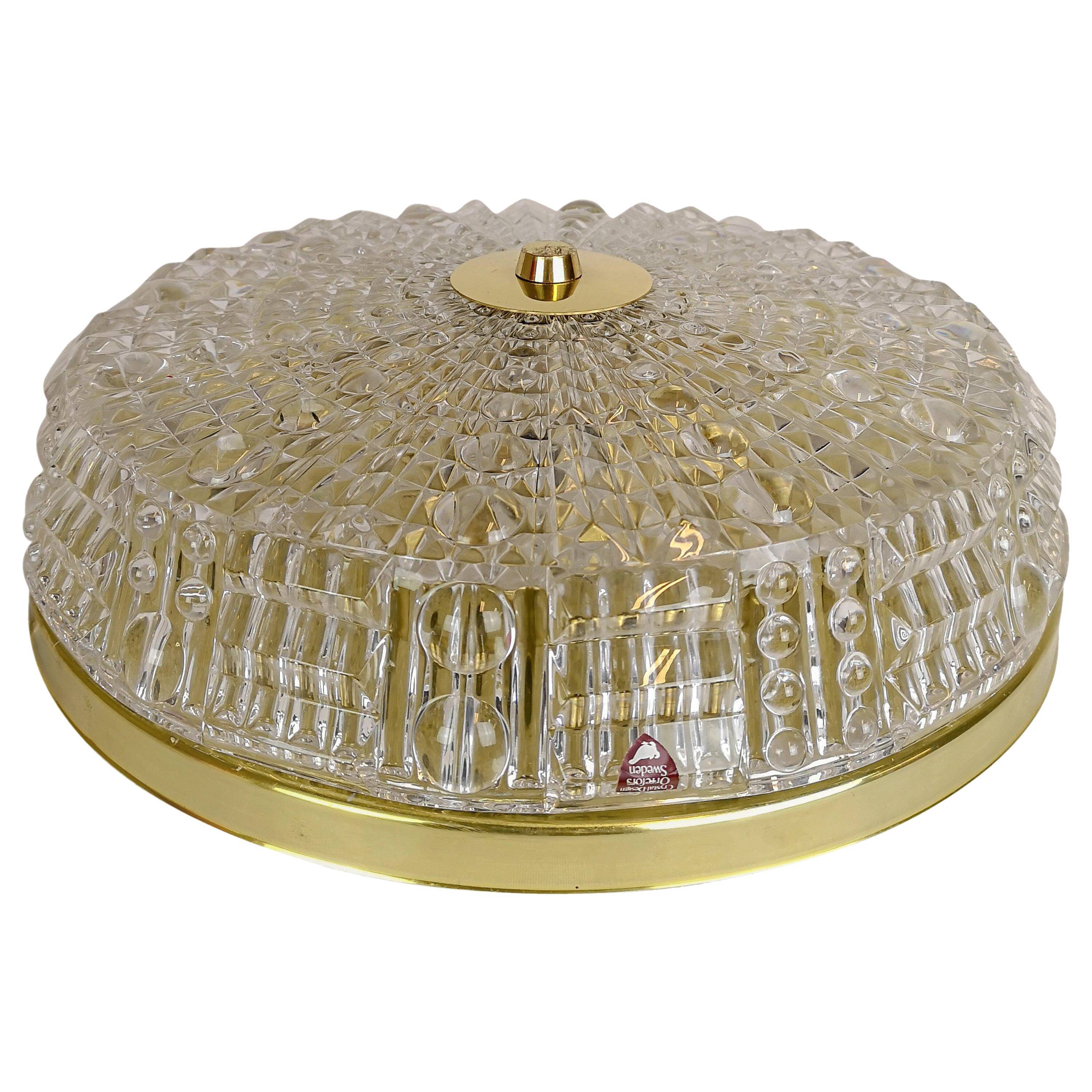 Midcentury crystal and brass ceiling lamp by Orrefors, Carl Fagerlund, 1970s, Sweden.
