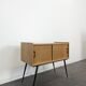 Modernist sideboard with 2 doors in oak veneer.