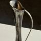 Vintage silver-plated soliflore vase with a dark patina in the shape of a ewer.