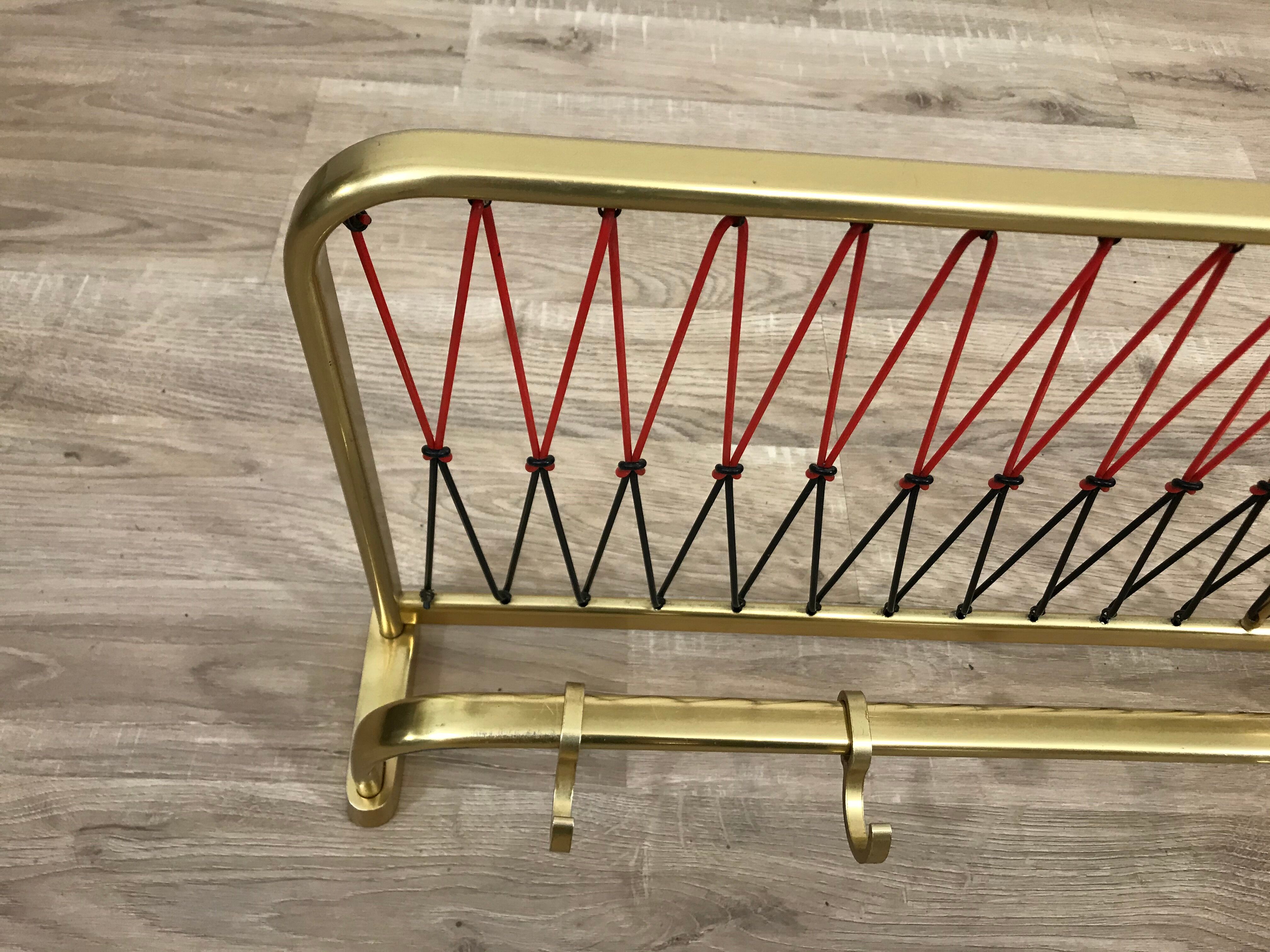 Coat rack with scoubidou shelf