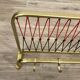Coat rack with scoubidou shelf