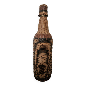 Glass and rattan bottle