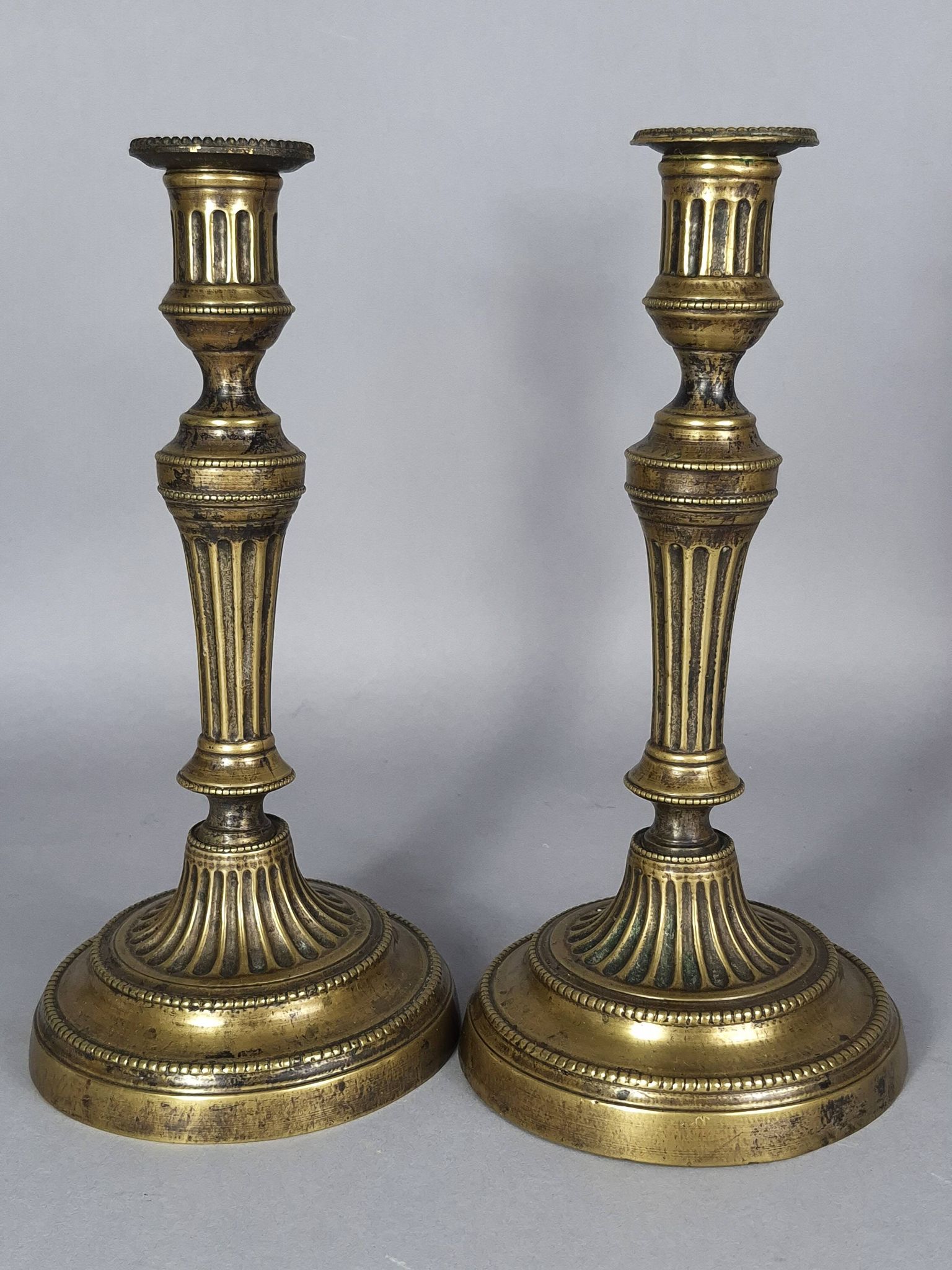 Pair of fluted bronze candlesticks Louis XVI period 27 cm