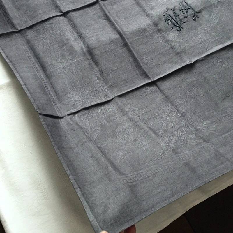 Old embroidered table napkin MA dark grey