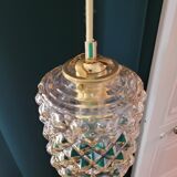 Moulded glass lamp with a cubic-spherical relief design.