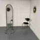 Large freestanding chrome metal full-length mirror in 1970s design.