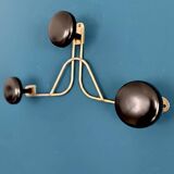 Golden brass coat rack with 3 black vintage hooks from the Mid Century 1950-60.