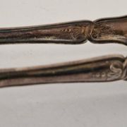 I030 Sugar tongs in silver-plated rock – Louis XV style