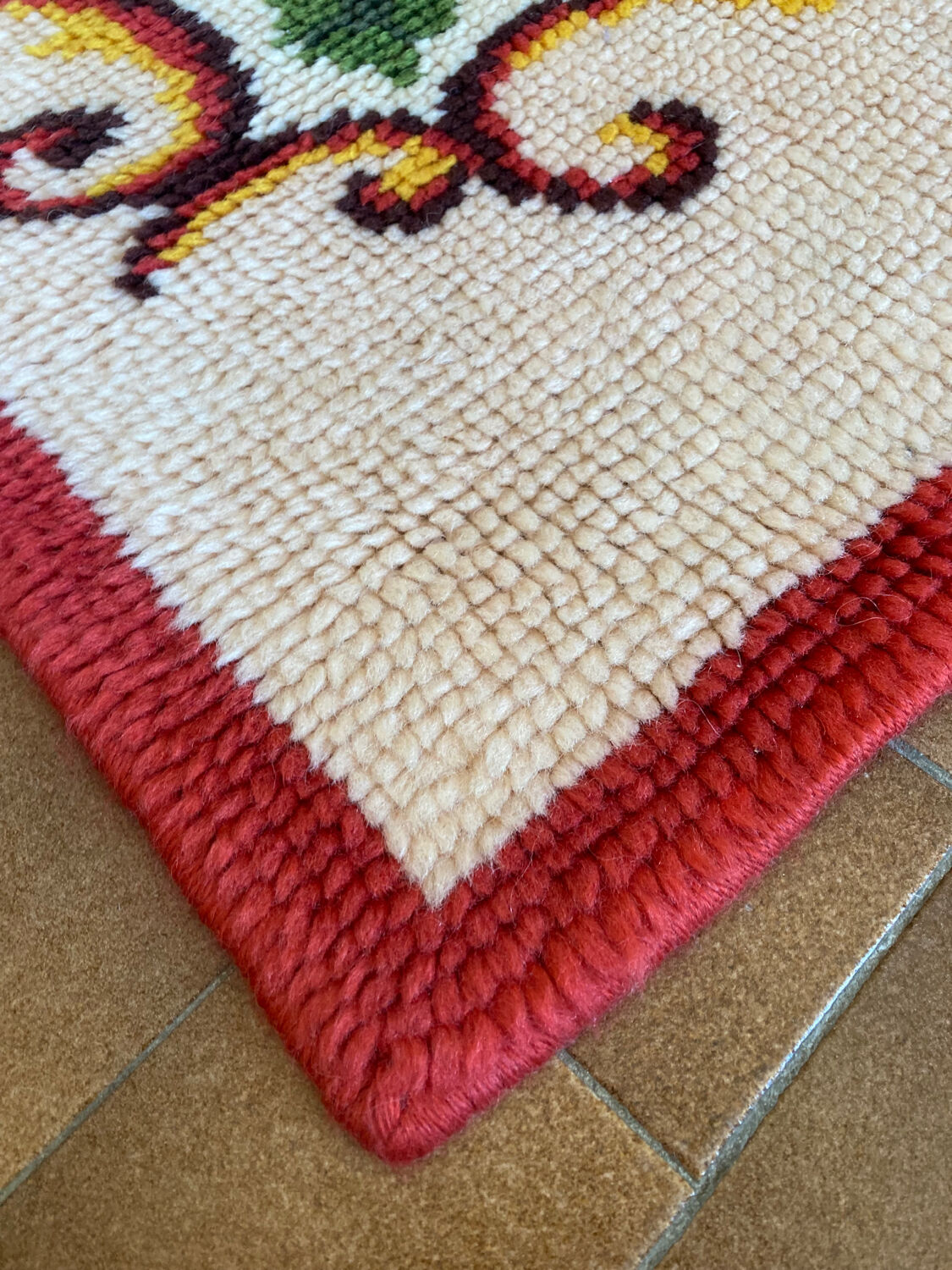 Vintage wool rug with floral decor