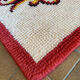 Vintage wool rug with floral decor