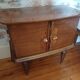 varnished wooden bedside table from the 1970s