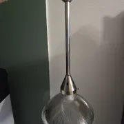 Vintage globe-style holophane on a chrome stem.