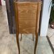 A bedside table with a drawer and a niche in Louis XV style.