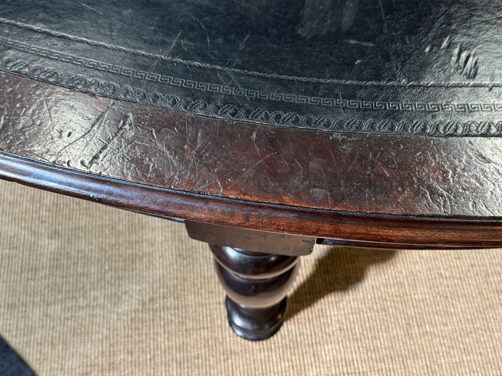 Large English library table in dark walnut with a leather top.