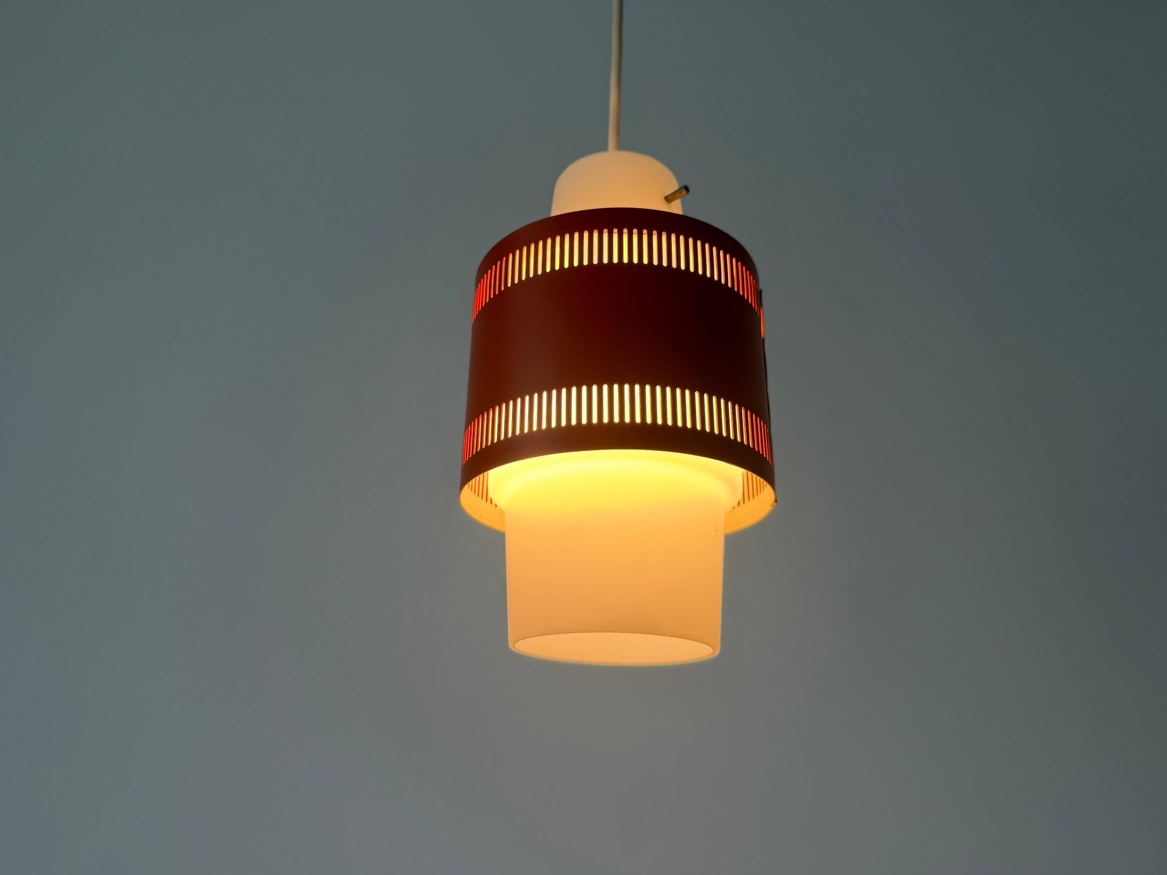 Glass ceiling light with an orange metal frame, 1960s, Germany.