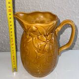 Old pitcher decorated with flowers