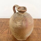 Small antique stoneware jar with handle