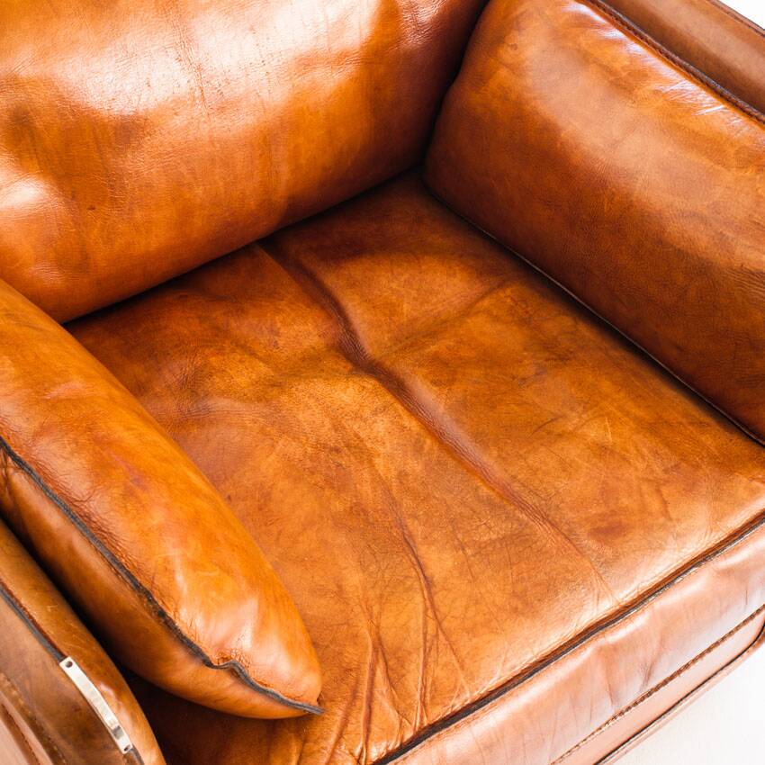 Vintage club armchair by Roche Bobois. Camel buffalo leather. France, 1980s.