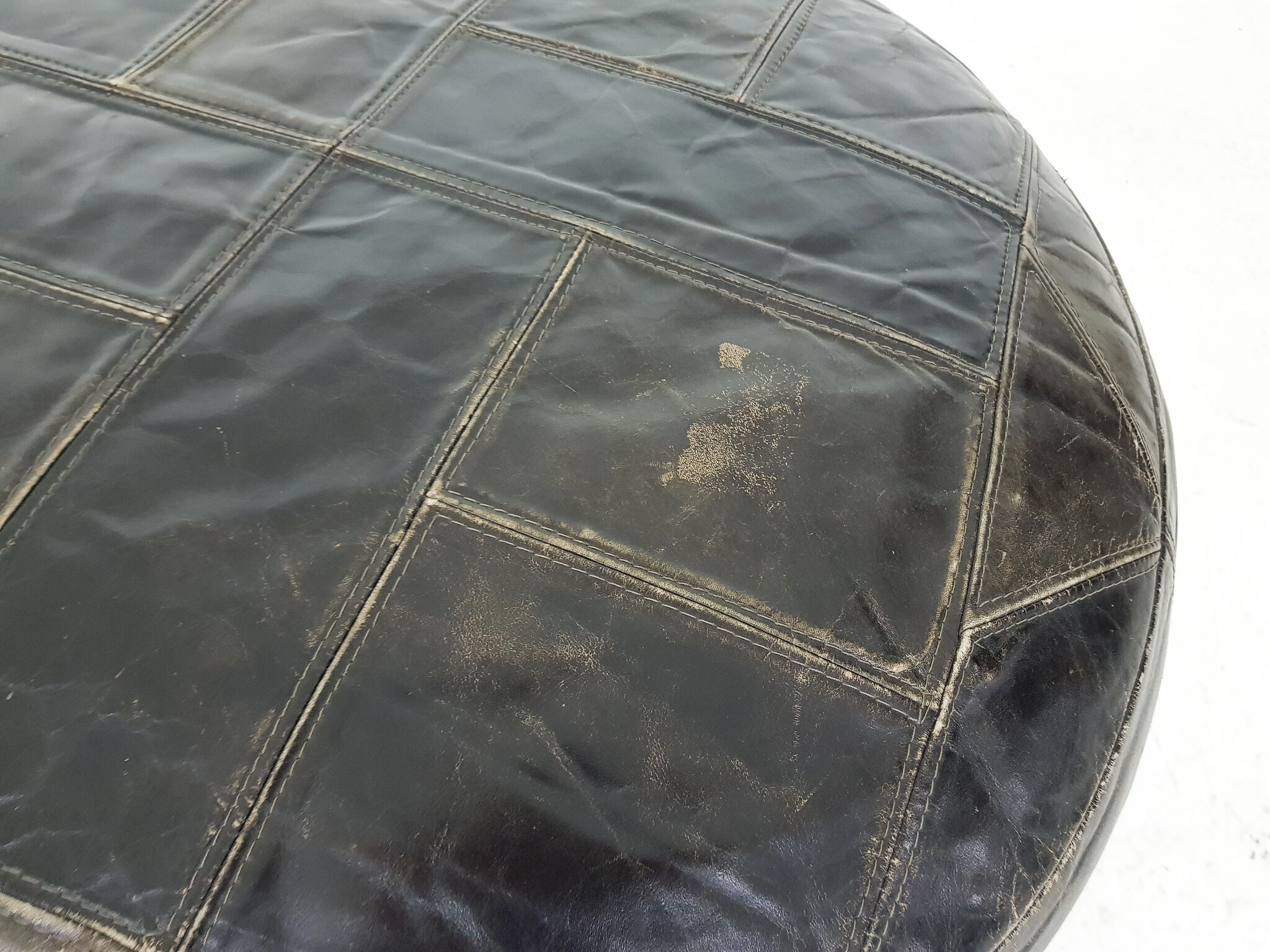 Mid-century round leather ottoman